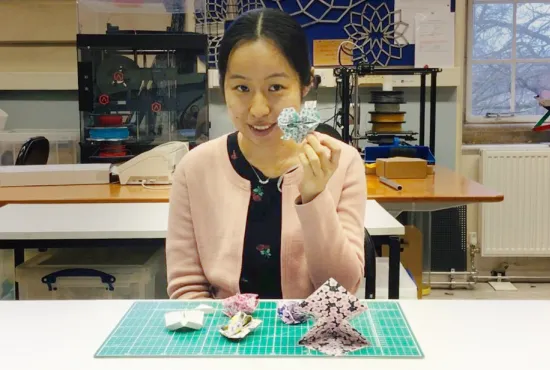 Dr Chenying Liu holding origami