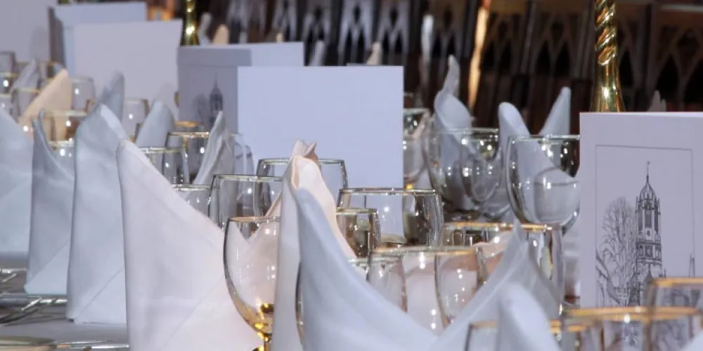 Tables laid for dinner in the Great Hall