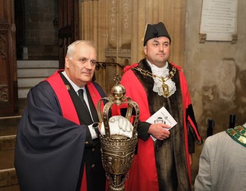 Lord Mayor Mike Rowley, in his ceremonial robes, chain and bicorne hat, with the City ceremonial mace and its bearer