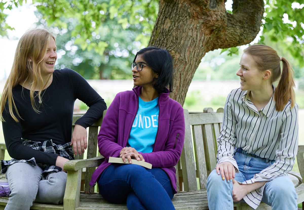 Students relaxing in the Masters Garden