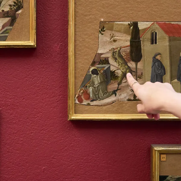 People looking at details in a painting