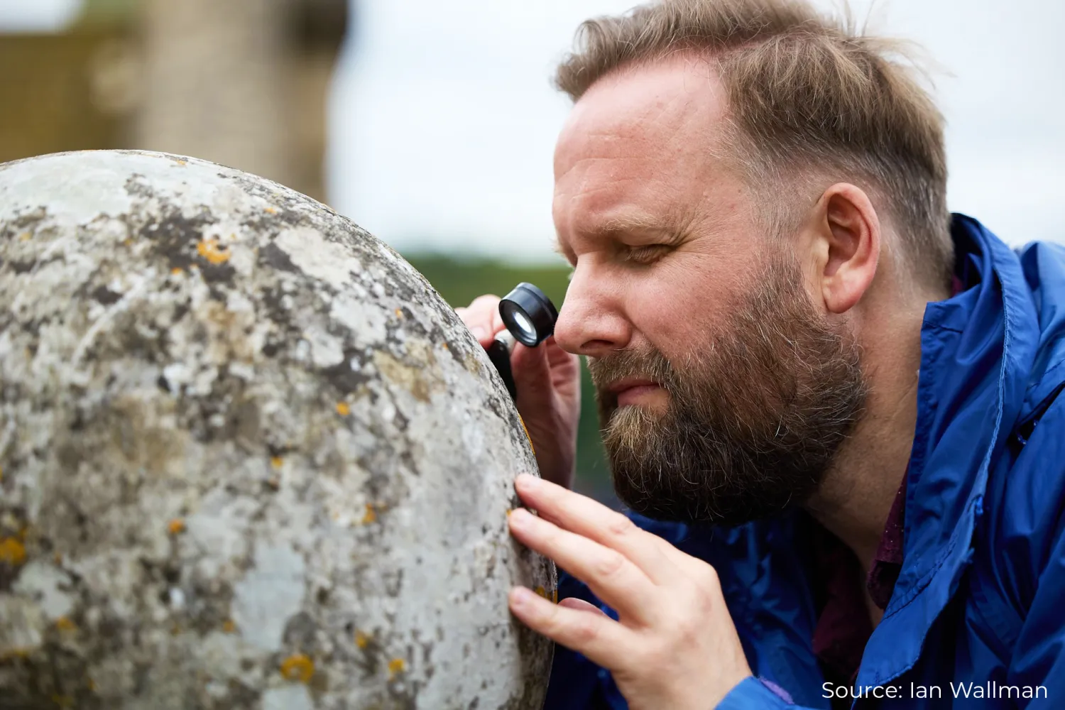 Dr Nicholas Carter inspecting some lichens