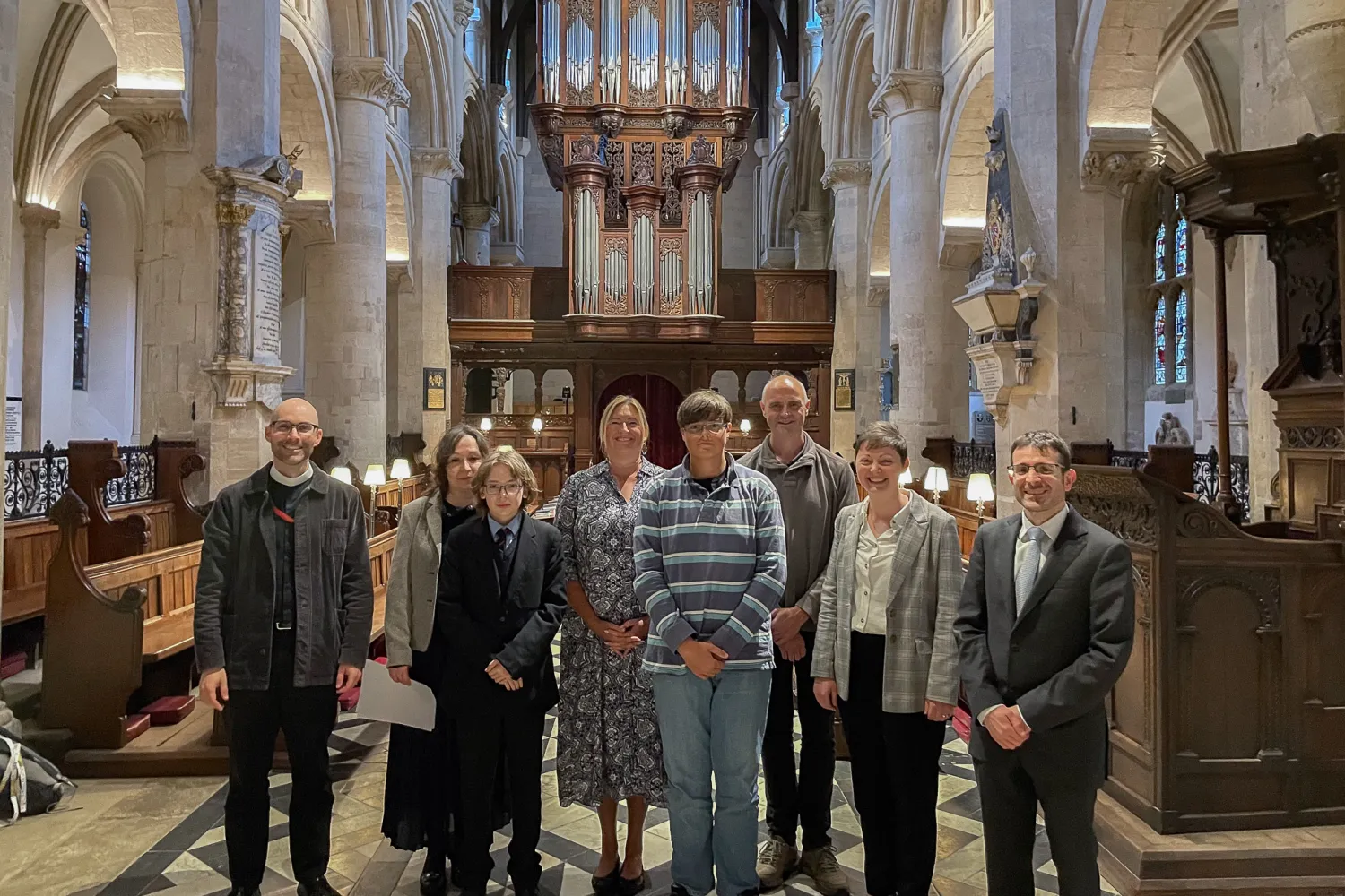 YOST Scholars and families in the Cathedral nave with Revd Zack Guiliano, Roxanne Gull, and Nicholas Prozzillo