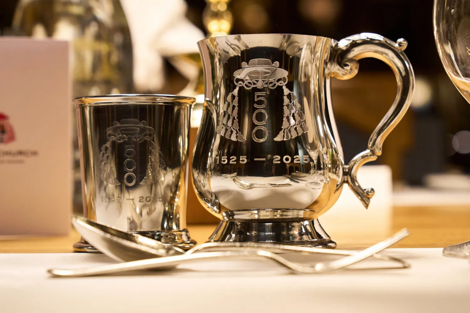 Silver tankards with 500th Anniversary branding at the 1525 Banquet