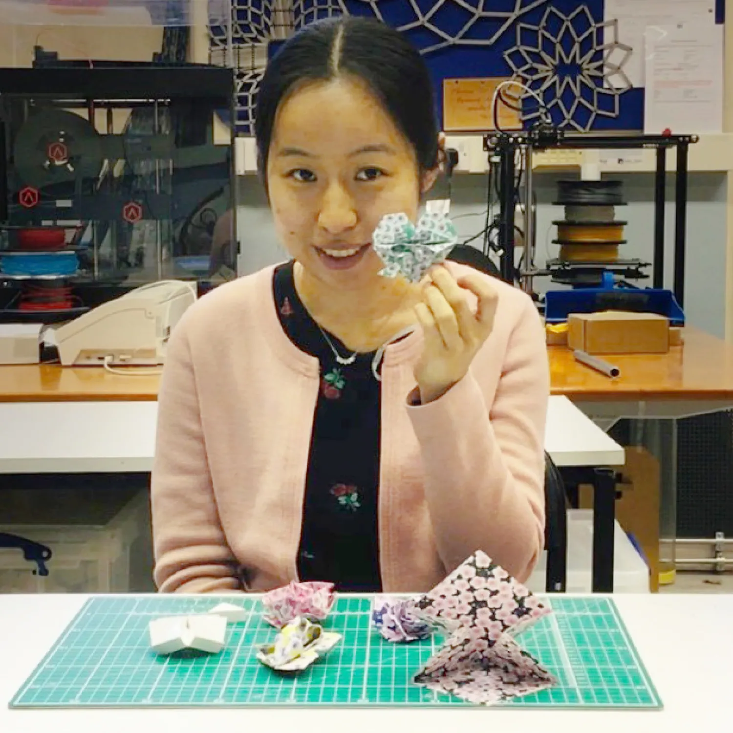 Dr Chenying Liu holding origami