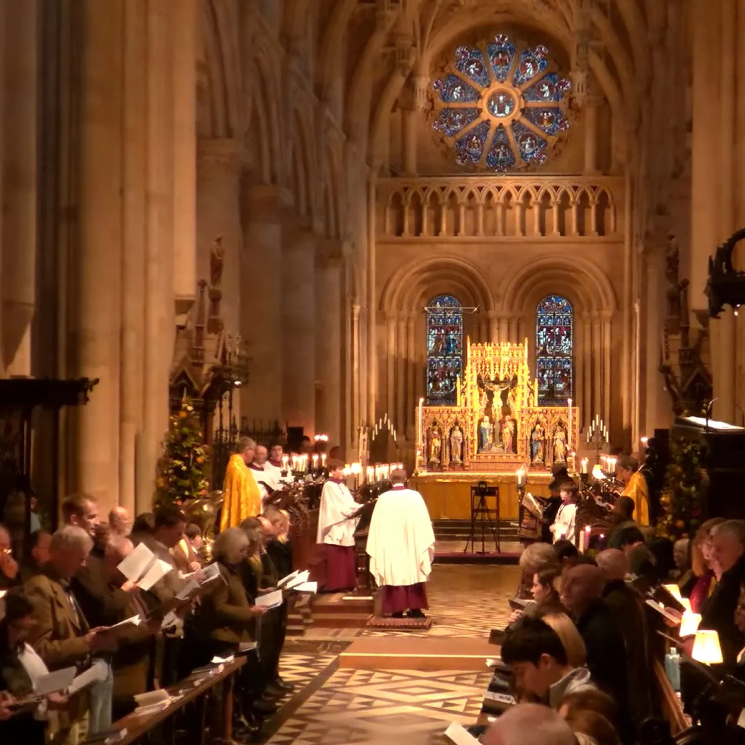 The Cathedral nave is full of worshippers, choir and clergy for a Christmas Eve service of nine lessons and carols. A Christmas tree by the sub dean's stall is adding festive cheer.